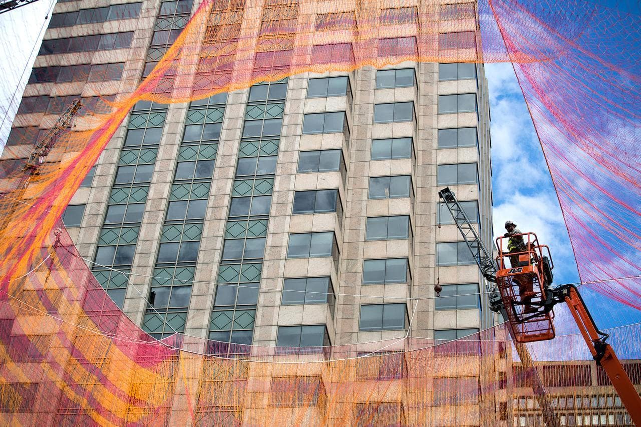 Looking up through one on the openings in Janet Echelman's aerial sculpture on The Greenway. (Robin Lubbock/WBUR)