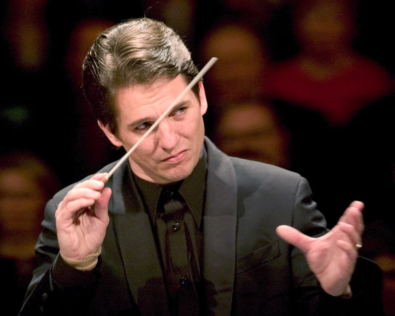 Celebrating his 10th year as conductor of the Boston Pops, Keith Lockhart conducts the orchestra on opening night in Boston, Tuesday, May 11, 2004. (Robert E. Klein/AP)