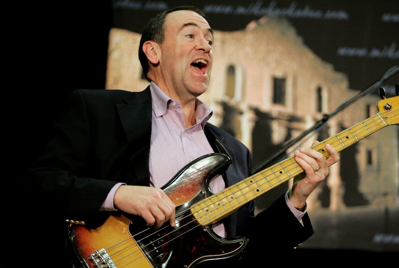 In his first bid for the presidency, Republican and former Arkansas Gov. Mike Huckabee, plays the bass guitar during a campaign stop in San Antonio, Texas in 2008. (Eric Gay/AP)