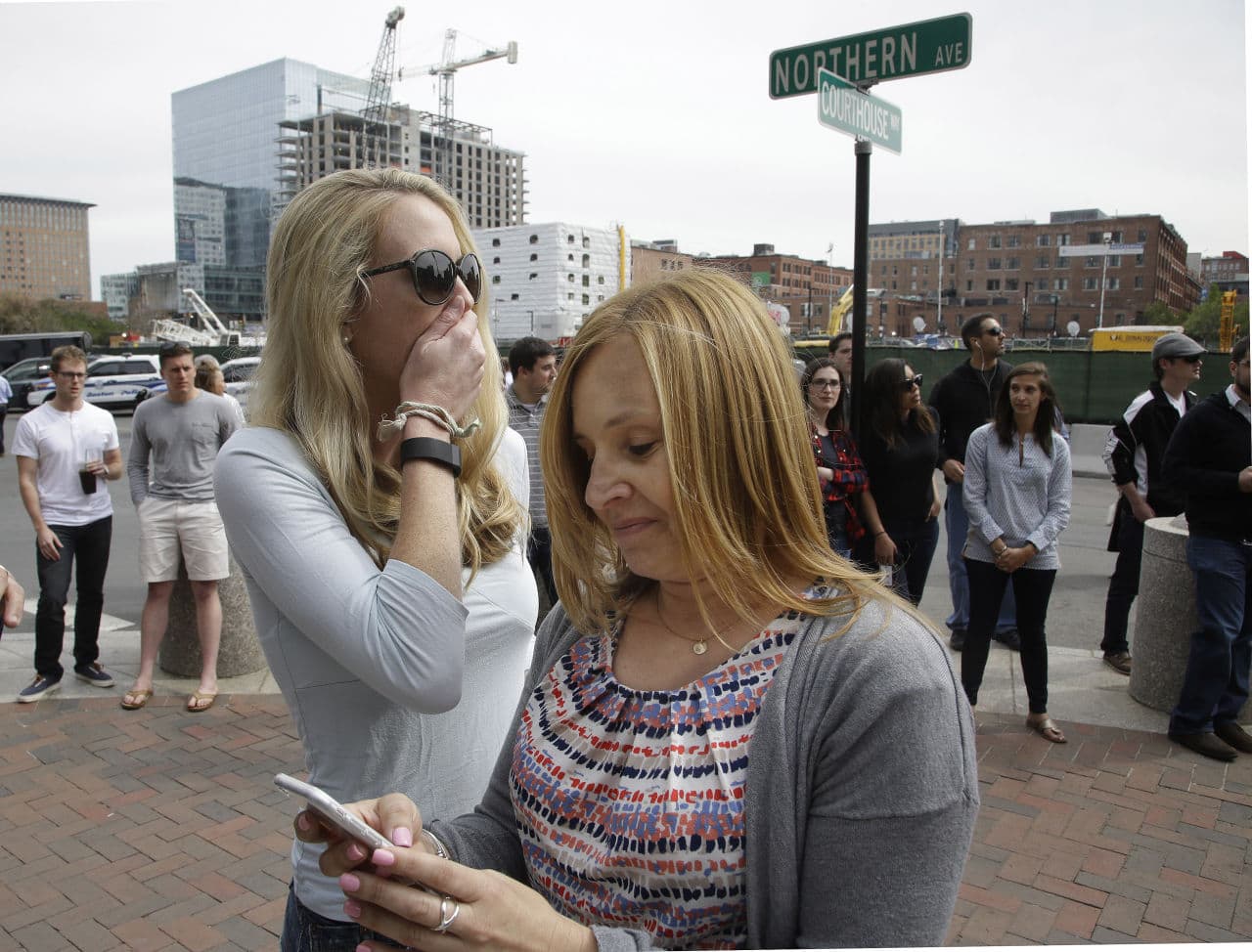 Karen Snyder, right, and Kathryn Vanwie react to the announcement of the death penalty verdict for Dzhokhar Tsarnaev on Friday. Both women felt the verdict was fair. (Stephan Savoia/AP)