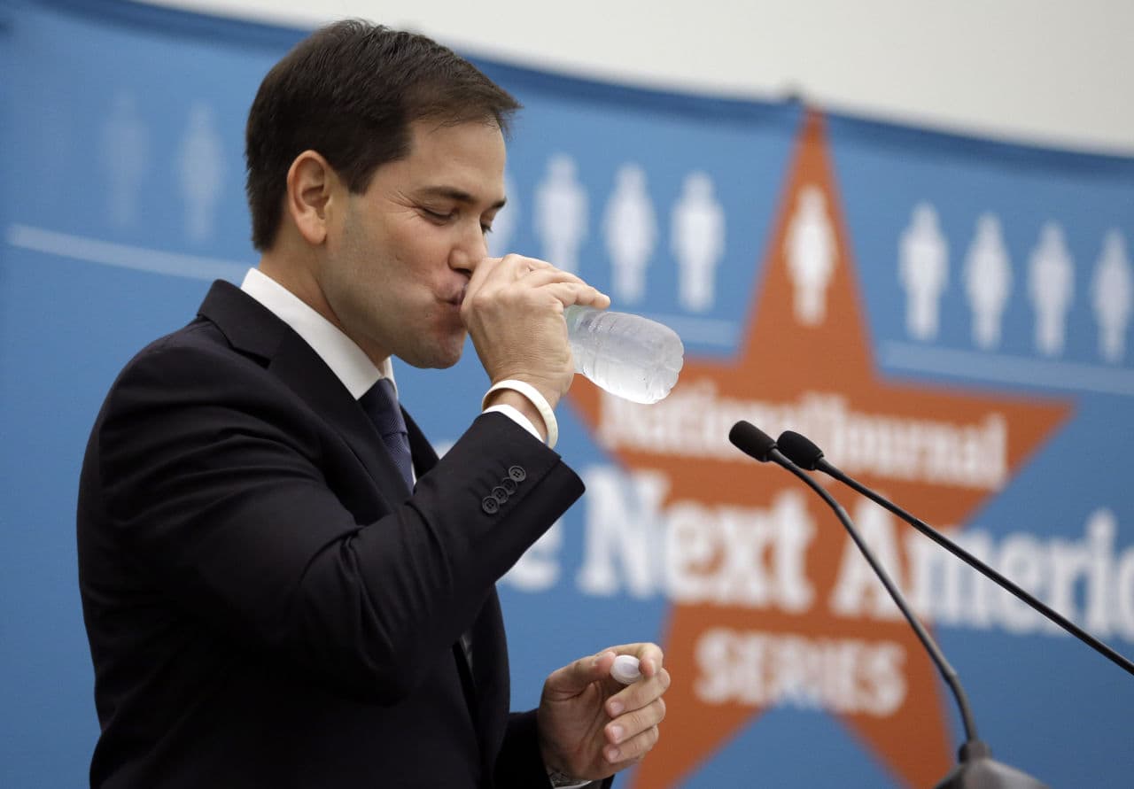 Sen. Marco Rubio takes a drink of water while speaking during a keynote address about his plans to overhaul the country&#039;s higher education system, before a panel discussion held by The National Journal at Miami-Dade College, Monday, Feb. 10, 2014, in Miami. (Lynne Sladky/AP)