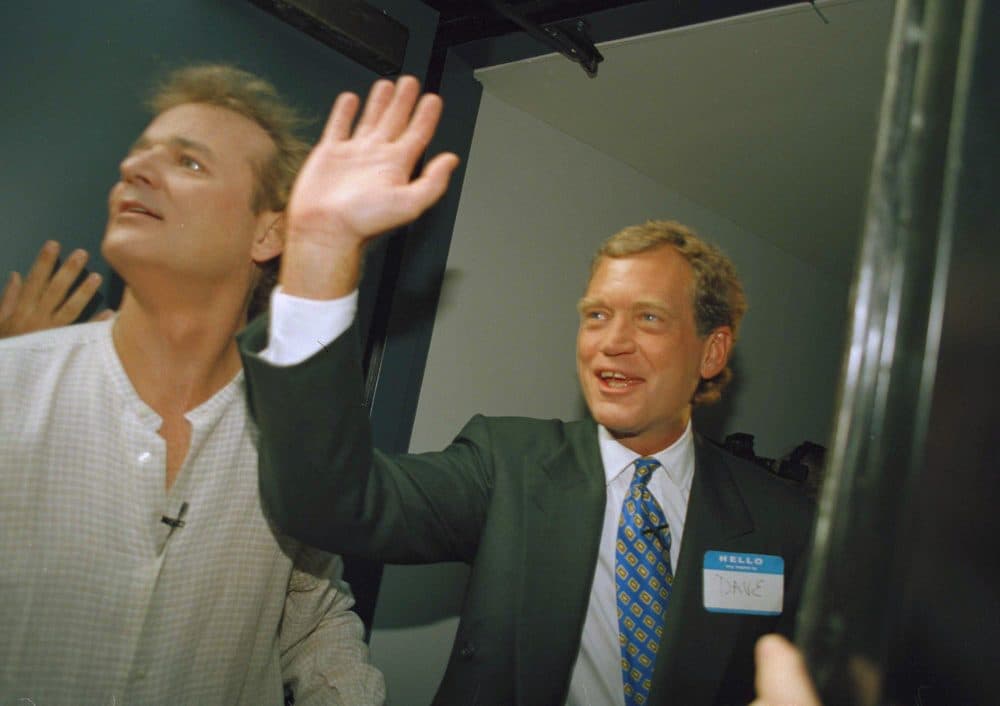 In this Aug. 30, 1993 file photo, David Letterman, right, and Bill Murray wave from the side door of the Ed Sullivan Theater during the first episode of "Late Show with David Letterman" in New York. After 33 years in late night and 22 years hosting CBS' "Late Show," Letterman will retire on May 20. (Jim Cooper/AP)