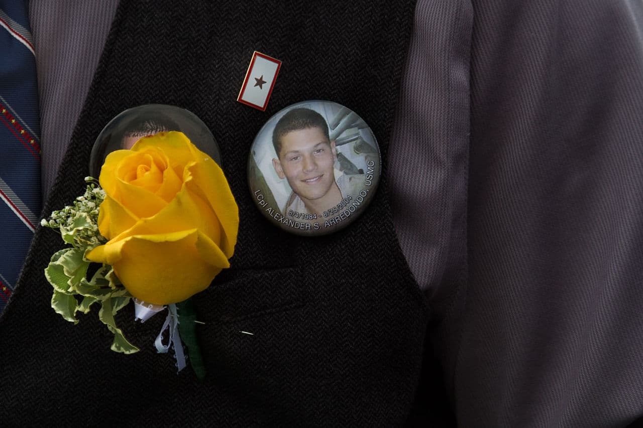 The lapel of Carlos Arredondo remembers his son, Lance Cpl. Alexander Arredondo, who was killed in Najaf, Iraq, during his second tour of duty on Aug. 25, 2004. (Jesse Costa/WBUR)