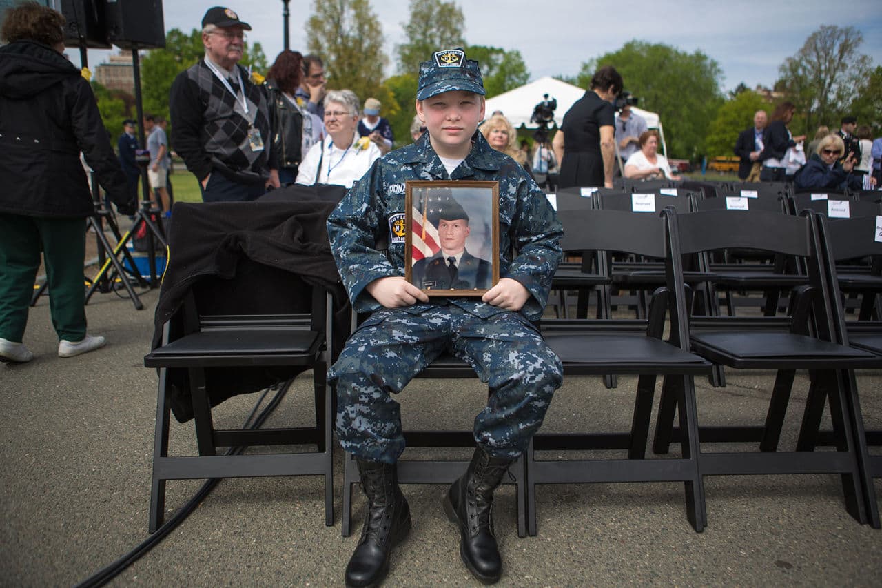 UNSLCC cadet Sean Donahue of Tewksbury waits for the ceremony to begin Thursday. He came to remember his uncle Freddy Maguire who served in the National Guard and died in Iraq. (Jesse Costa/WBUR)