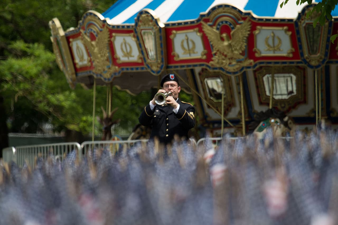 A bugler plays Taps to close the Massachusetts Military Heroes Fund ceremony at the Boston Common. (Jesse Costa/WBUR)