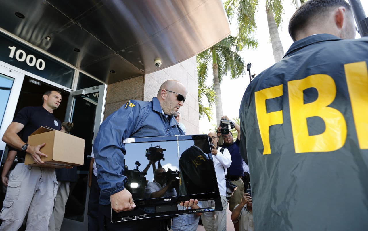 FBI agents carrying evidence out of CONCACAF after it was raided this week. (Joe Skipper/Getty Images)