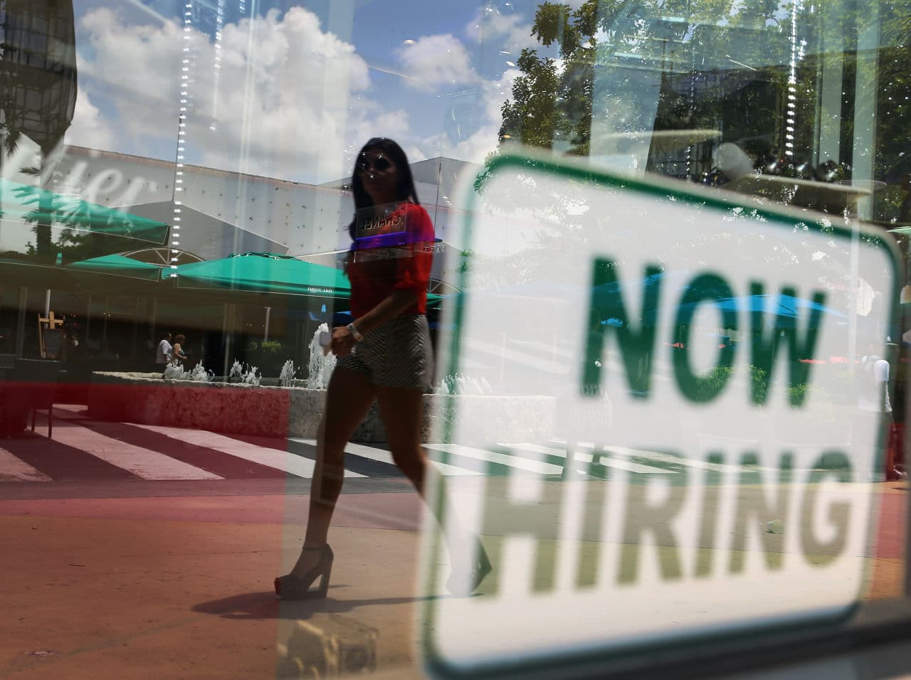 A "now hiring'' sign is seen in a storefront window on July 5, 2012 in Miami Beach, Florida. (Joe Raedle/Getty Images)