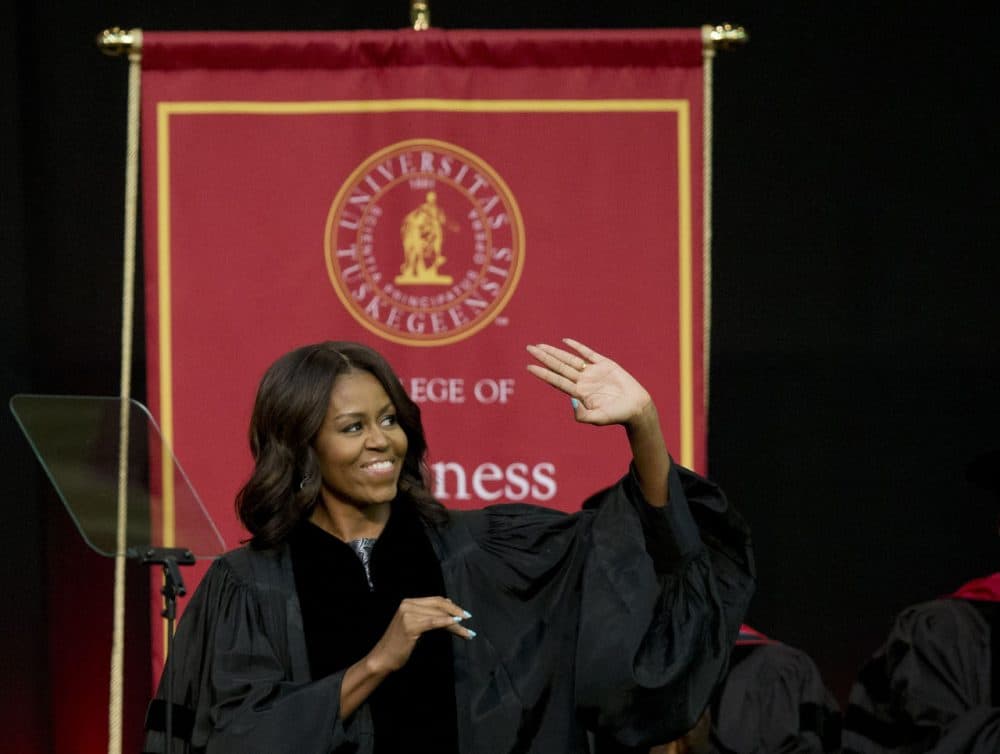 First lady Michelle Obama waves towards the crowd just before she delivers the commencement address at Tuskegee University on Saturday.(Brynn Anderson/AP)