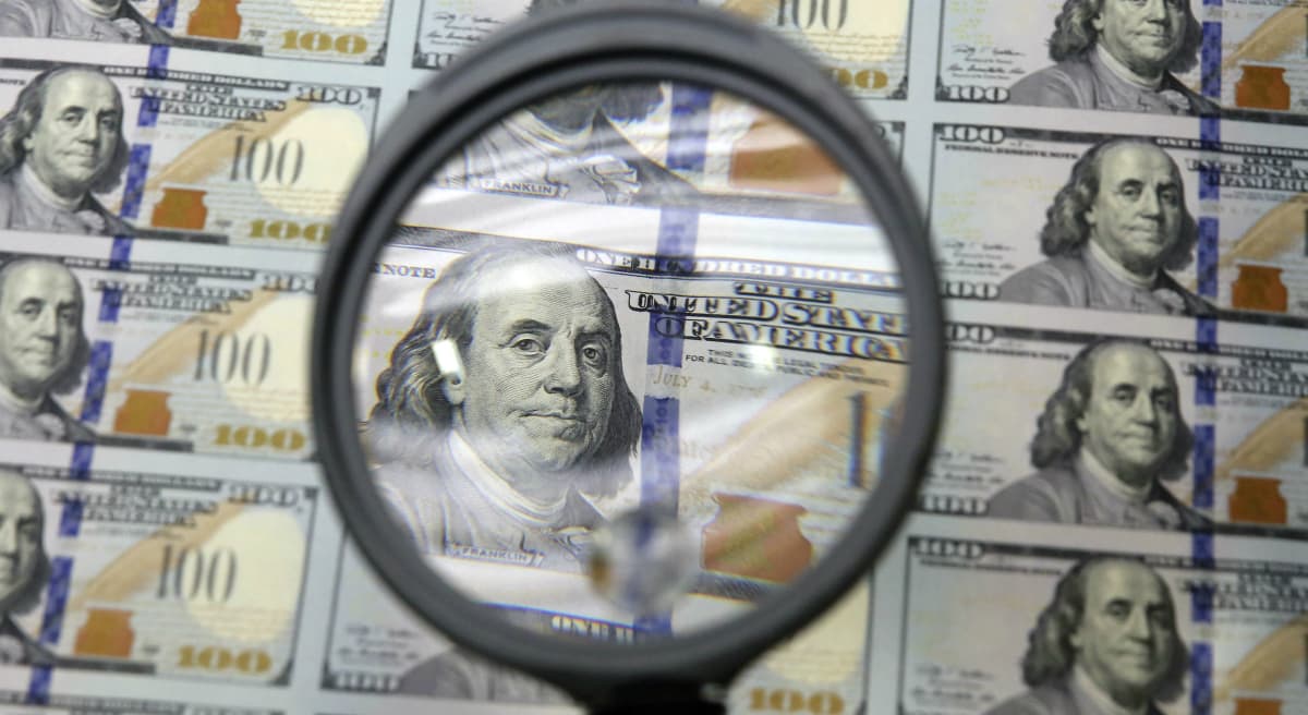 If you want to cure poverty, give people money, right? It's not that simple, says Rich Barlow. Pictured: A sheet of uncut $100 bills is inspected during the printing process at the Bureau of Engraving and Printing Western Currency Facility in Fort Worth, Texas on September 24, 2014. (LM Otero/AP)