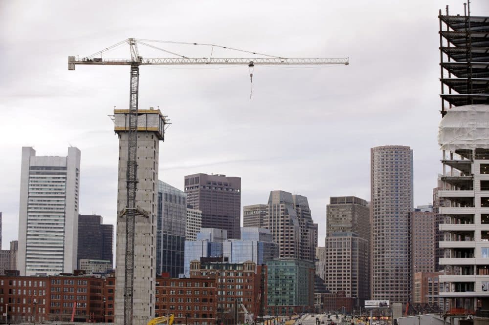 Several commercial construction projects in the Seaport district of Boston in 2014. (Stephan Savoia/AP)