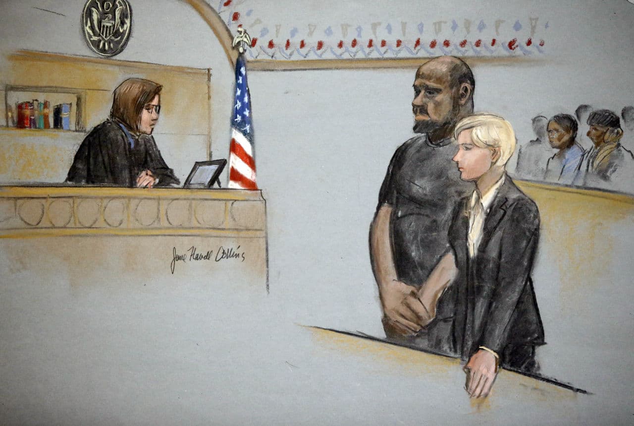 In this courtroom sketch, David Wright is depicted standing with his attorney Jessica Hedges, as Magistrate Judge Page Kelley presides during a hearing Wednesday in federal court in Boston. (Jane Flavell Collins via AP)