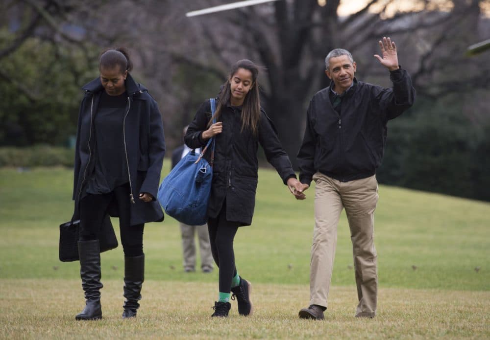 President Barack Obama returns to the White House with first lady Michelle Obama, and his daughters Sasha and Malia January 4, 2015 in Washington, D.C. (Kevin Dietsch/Getty Images)