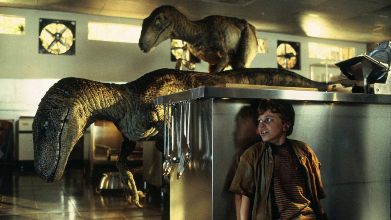 Velociraptors hunt Tim Murphy in the kitchen, in a famous nail-biting scene from Jurassic Park. (Universal Studios)
