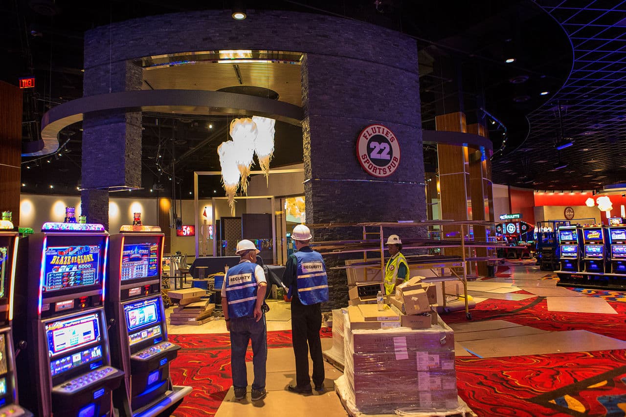 Workers survey Plainridge Park Casino, the state's lone slots parlor, which opens on June 24. (Jesse Costa/WBUR)