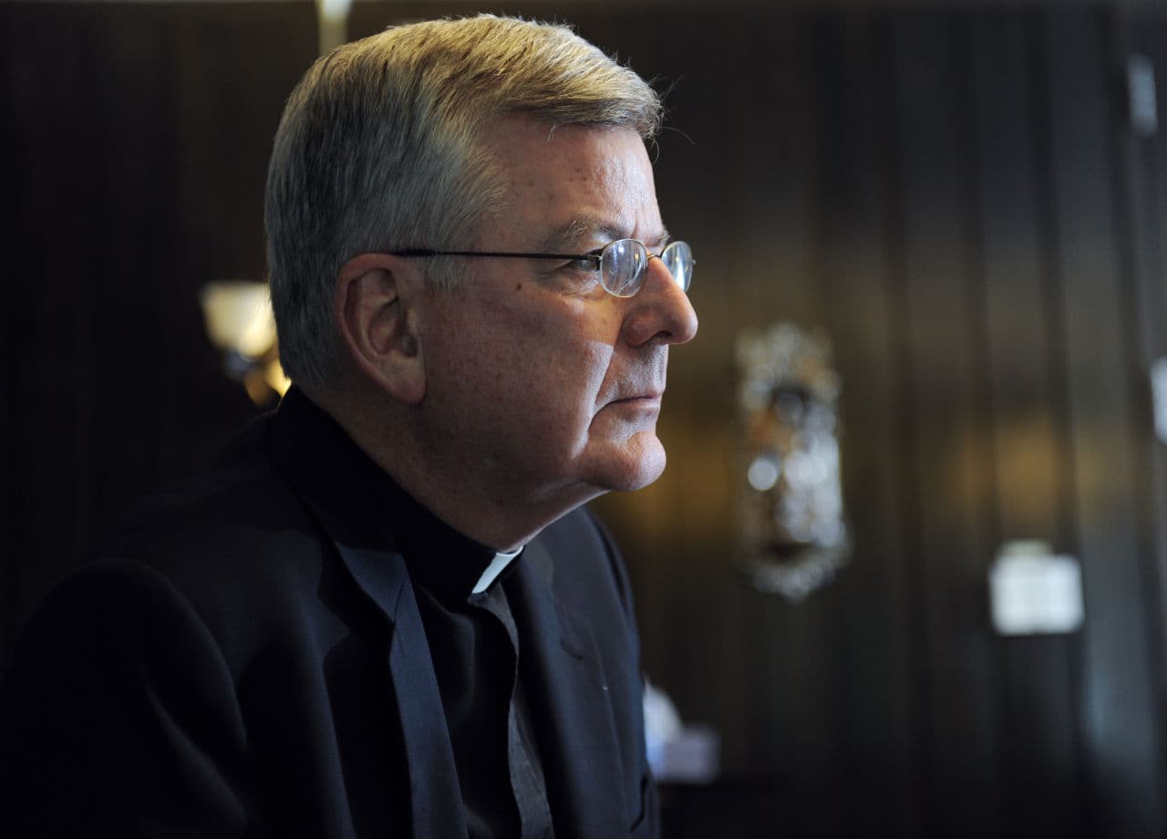 Archbishop John Nienstedt talks with a reporter at his office in St. Paul, Minn. after a law firm hired by the Archdiocese of St. Paul and Minneapolis finished its investigation of allegations of sexual misconduct with adults by Archbishop Nienstedt, Wednesday, July 30, 2014.(Craig Lassig/AP)