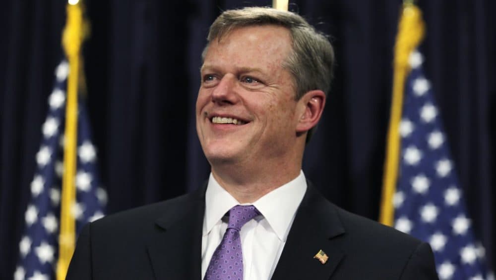 Recent WBUR polling data found that nearly 70 percent of voters have a &quot;favorable&quot; opinion of Gov. Charlie Baker. In March, Baker smiles before unveiling his 2016 budget proposal at the State House. (Charles Krupa/AP)