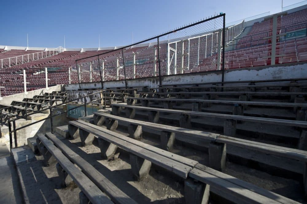 During Augusto Pinochet's rule of Chile, the National Stadium in Santiago served as a jail for prisoners. In remembrence of the tens of thousands of prisoners that were housed in the stadium, a section of seats remain the same as they were in Pinochet's dictatorship. The seats are always empty. (Martin Bernetti/AFP/Getty Images)