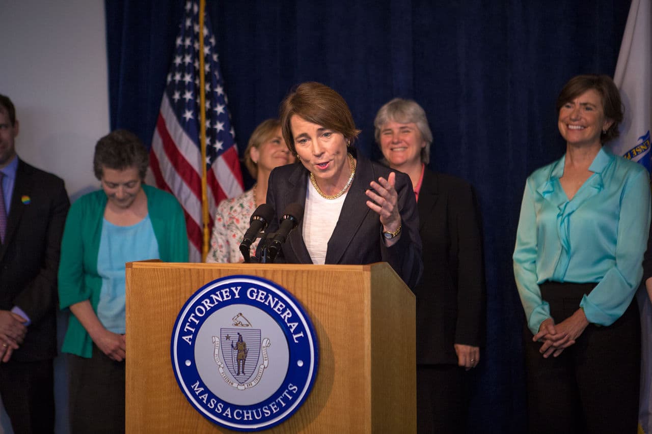 State Attorney General Maura Healey, who is gay, lauds the Supreme Court's decision to make same-sex marriage legal in all 50 states, at a news conference at her Boston office Friday. Former AG Martha Coakley is behind Healey's right shoulder. (Jesse Costa/WBUR)