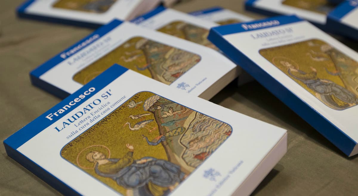 Copies of Pope Francis' encyclical "Laudato Si," are displayed prior to the start of a press conference, at the Vatican, Thursday, June 18, 2015. Pope Francis called for a bold cultural revolution to correct what he calls the "structurally perverse" economic system of the rich exploiting the poor that is turning Earth into an "immense pile of filth."(Andrew Medichini/AP)