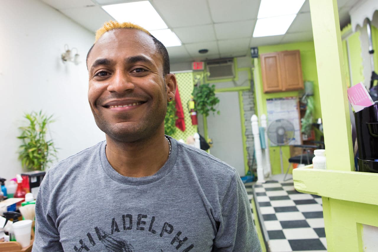 Carlos Cabral owns a beauty parlor in Roslindale. (Jesse Costa/WBUR)