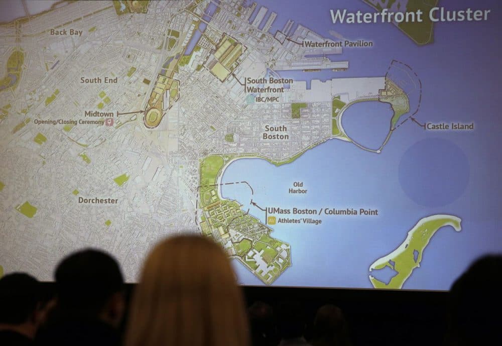 Reporters view a display of possible Olympic venue sites back in January. WBUR's latest poll on hosting the 2024 Summer Games finds support raises substantially under  the scenario of Olympic venues spread across the Bay State, rather than clustered around Greater Boston. (Charles Krupa/AP)