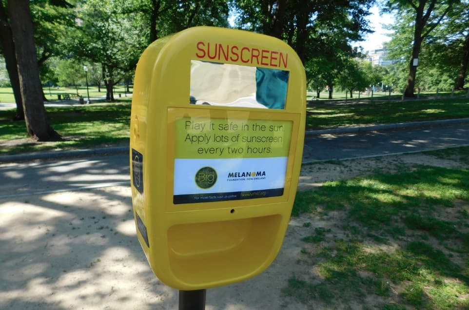 The dispensers being installed in Boston parks (Courtesy of the Melanoma Foundation of New England)