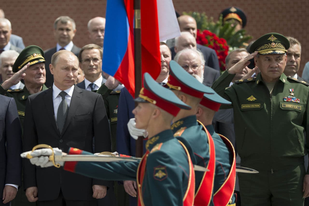 Russian President Vladimir Putin, left, takes part in a wreath laying ceremony at the Tomb of the Unknown Soldier outside Moscow's Kremlin Wall, in Moscow, Russia, Monday, June 22, 2015, to mark the 74th anniversary of the Nazi invasion of the Soviet Union. (AP)