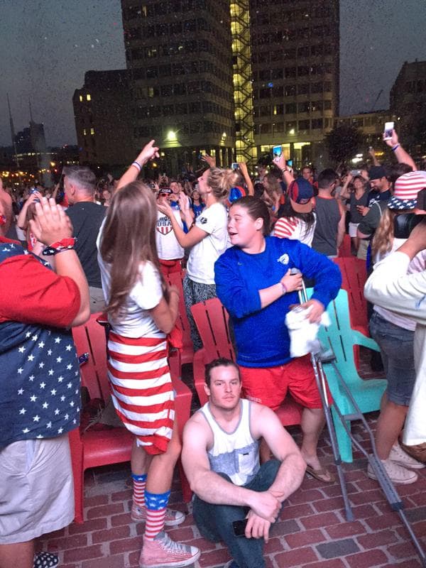 Fans celebrate on Boston's City Hall Plaza after the USWNT 5-2 victory over Japan. (Jack Lepiarz//WBUR)