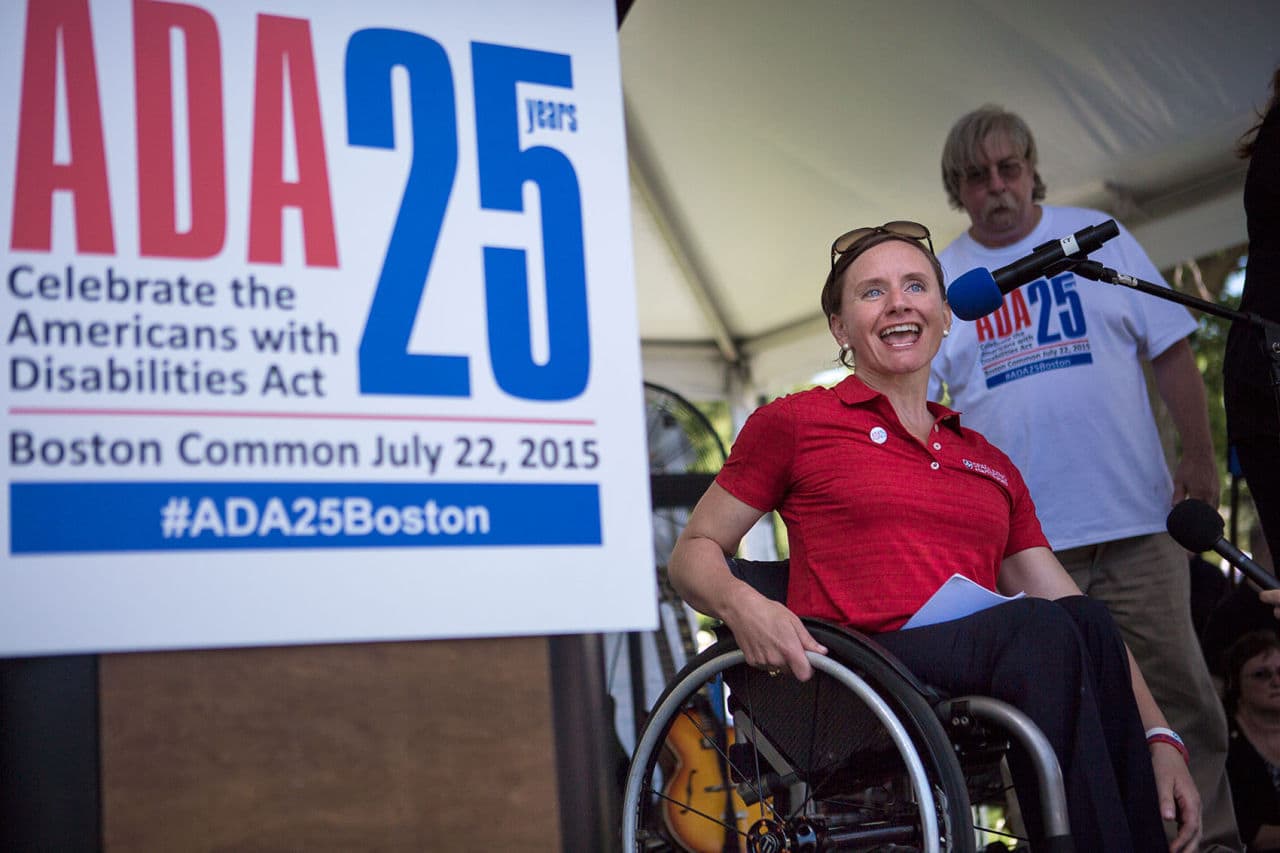 Cheri Blauwet, an Olympic wheelchair racer and a doctor,speaks at a rally on Boston Common Wednesday celebrating 25 years since the passing of the American Disabilities Act. (Jesse Costa/WBUR)