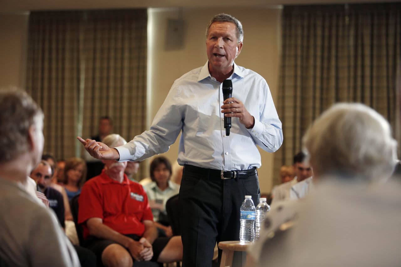 Republican presidential candidate Gov. John Kasich speaks at a town hall style meeting on Tuesday in Nashua, N.H. (Jim Cole/AP)