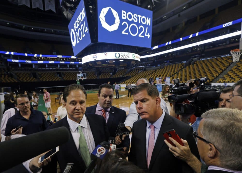 Boston 2024 Chairman Steve Pagliuca, left, and Boston Mayor Marty Walsh, right, speak to reporters in June at TD Garden. (Elise Amendola/AP)