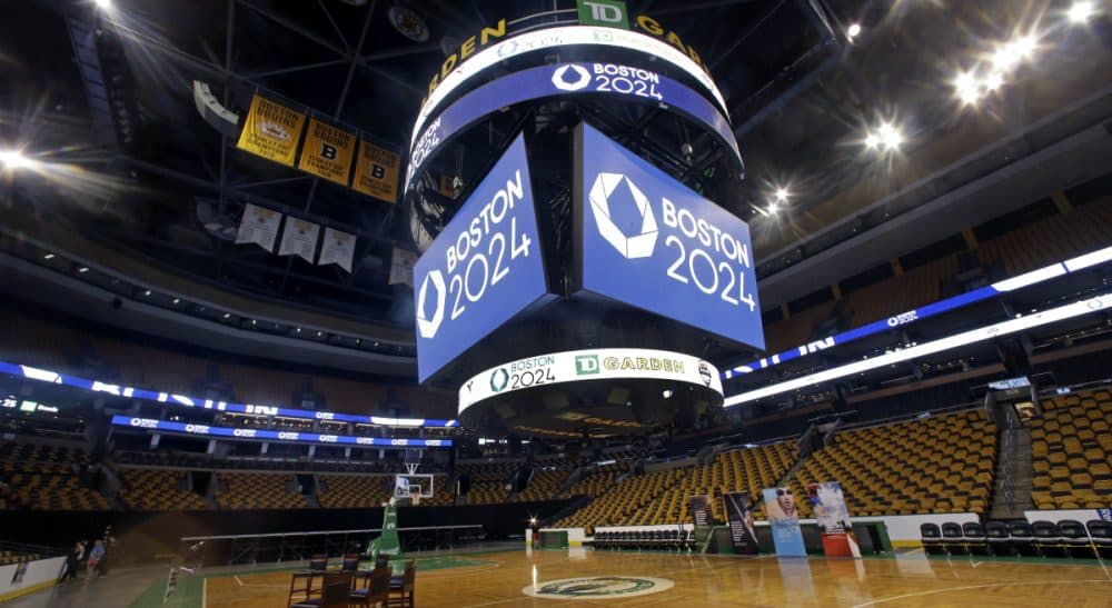 Display boards on and over the parquet floor at the TD Garden remain in place after a news conference, Thursday, June 18, 2015, in Boston, where it was announced that TD Garden would be the site of the Olympic and Paralympic basketball finals and Olympic gymnastics and trampoline if the city wins a bid to host the 2024 games. (Elise Amendola/AP)