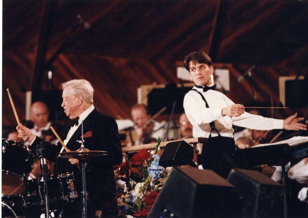 Conductor Keith Lockhart leads the Boston Pops Fourth of July show at the Hatch Shell for the first time in 1995, alongside Mel Torme . (Courtesy BSO)