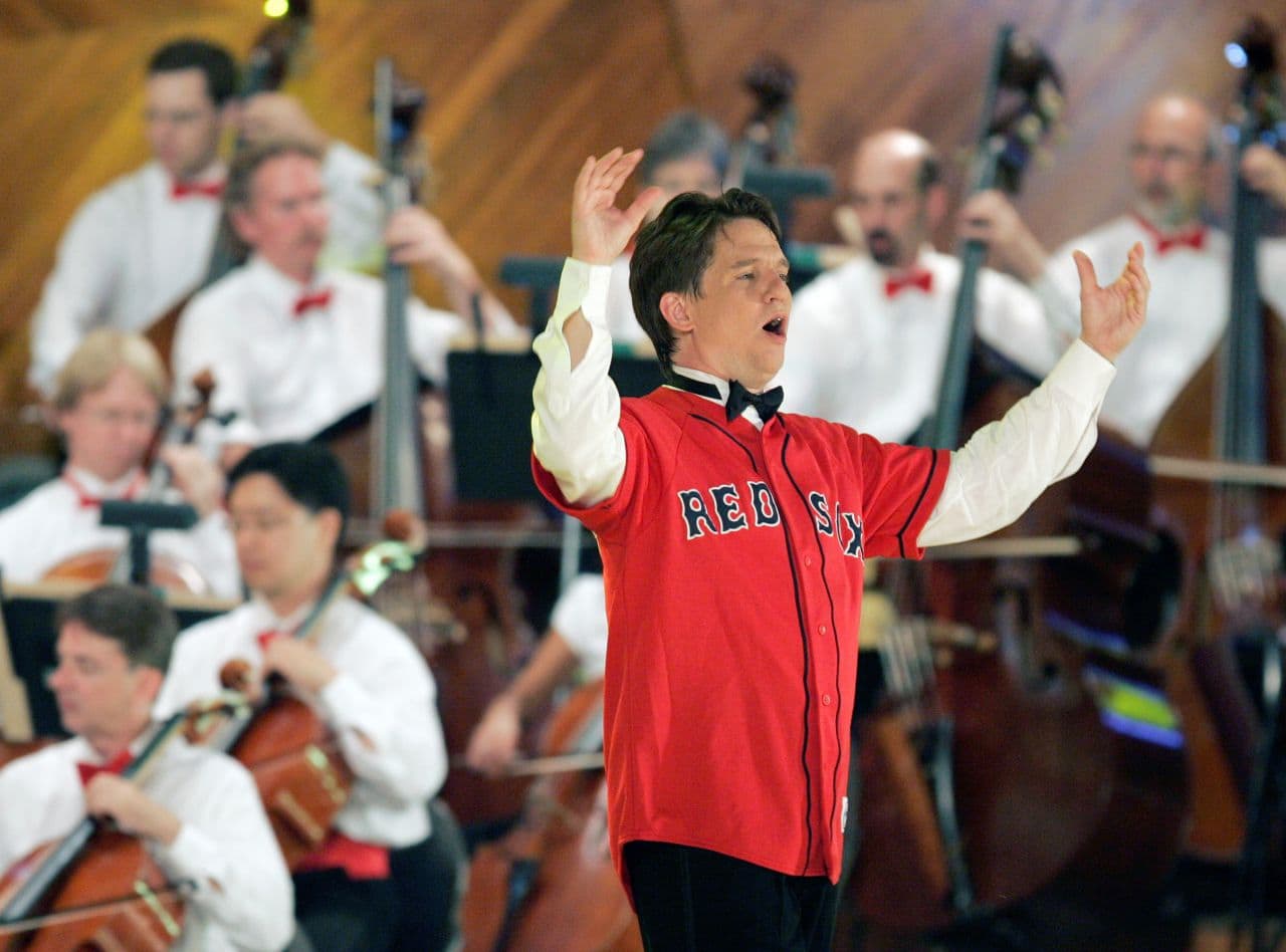 Lockhart, donning a Red Sox jersey, conducts the Boston Pops during the orchestra's rehearsal concert on July 3, 2008. (Michael Dwyer/AP)
