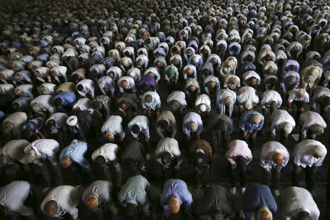 Iranian worshippers perform their Friday prayer at the Tehran University campus in Tehran, Iran, Friday, July 17, 2015. The main prayer service in the Iranian capital has been interrupted by repeated chants of "Death to America," despite last week's landmark nuclear deal with world powers that was welcomed by authorities in Tehran. (Vahid Salemi/AP)