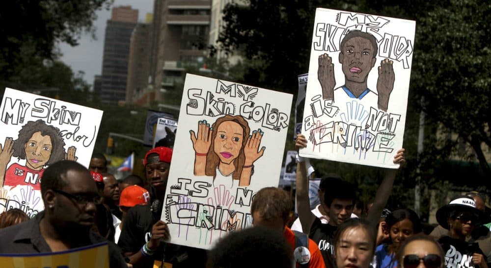 Jabari Asim: What the officer saw when he thought he saw me, and what that costs. Pictured: &quot;My Skin Color Is Not A Crime.&quot; Demonstrators hold signs during a silent march in New York to end the New York City Police Department’s &quot;stop-and-frisk&quot; program, June 17, 2012. (Seth Wenig/AP)