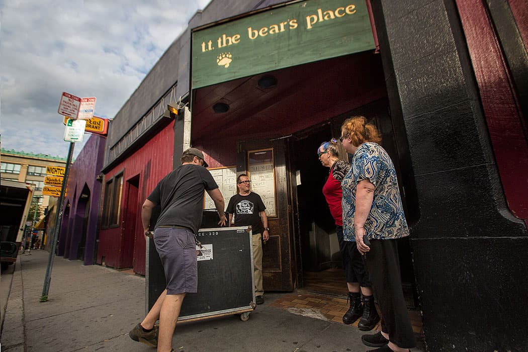 As manager Kevin Patey opens the doors at T.T. the Bear’s, Jutes Leeden and Tina Forsyth inquire about ticket sales wanting to see the band Stop Calling Me Frank during the clubs final week of shows. (Jesse Costa/WBUR)