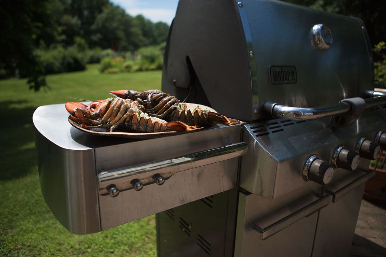 A pair of lobsters are ready to be grilled. (Jesse Costa/WBUR)