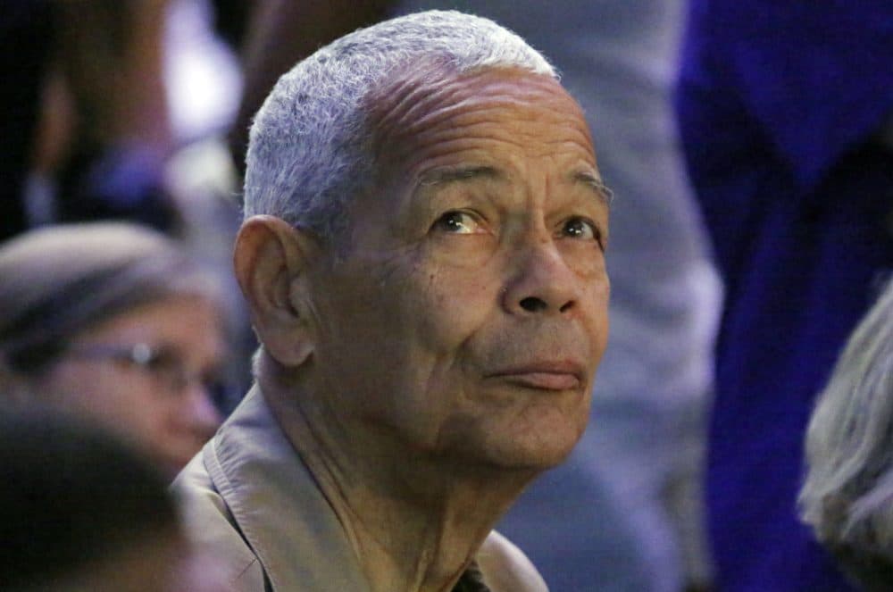 Julian Bond, one of the founders of the Student Nonviolent Coordinating Committee and an American social activist, watches a presentation on overhead video screens at the 50th Anniversary Freedom Summer conference at Tougaloo College in Jackson, Miss., Thursday, June 26, 2014. (AP Photo/Rogelio V. Solis)