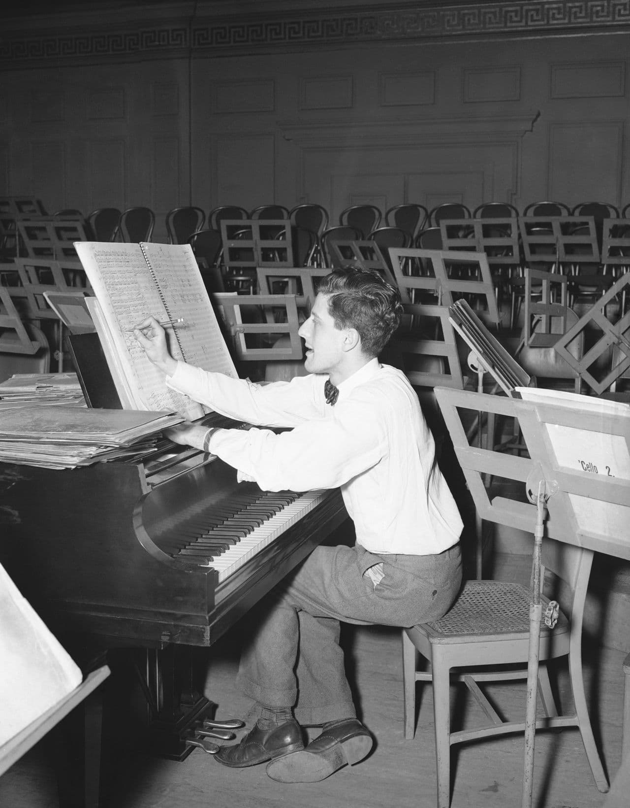 Lukas Foss in 1947 working on last-minute notations on the score of his symphonic work. (AP)