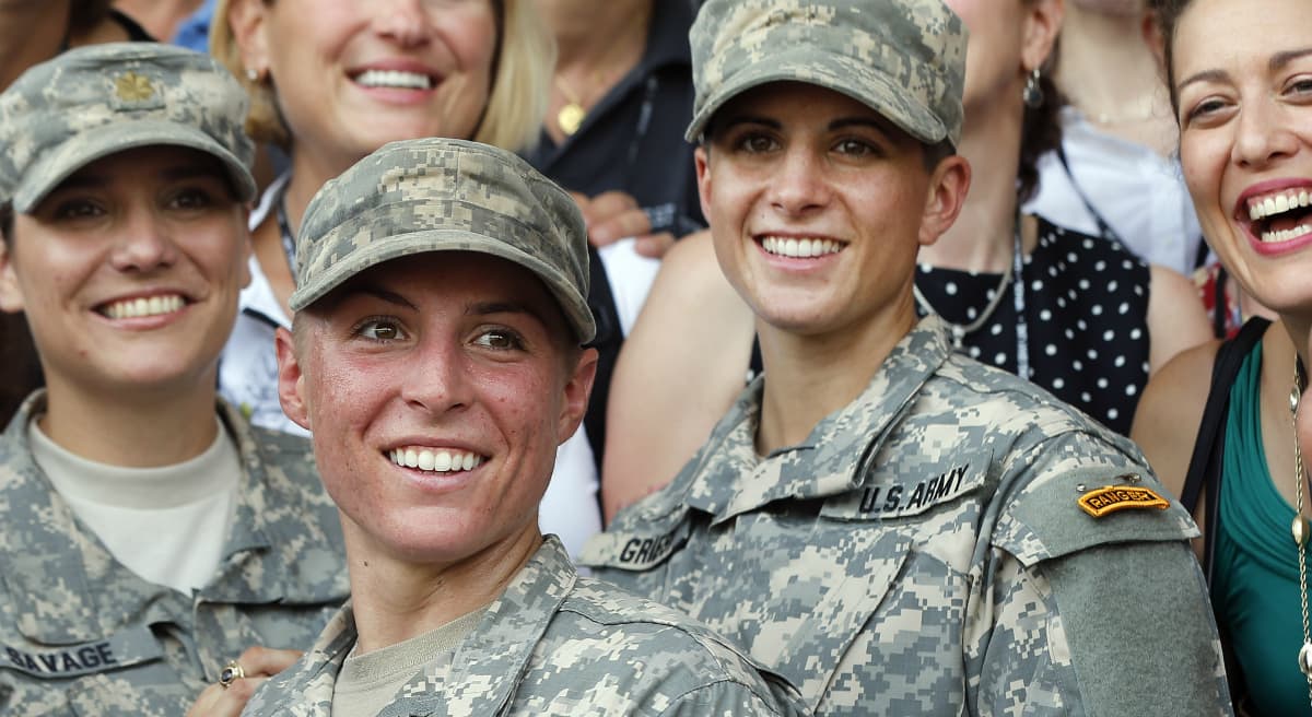 U.S. Army First Lt. Shaye Haver, center, and Capt. Kristen Griest, right, pose with other female West Point alumni at last Friday's graduation. (John Bazemore/AP) 