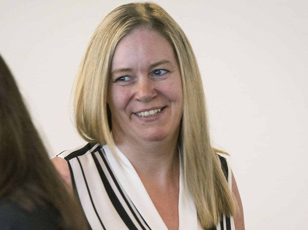 In this July 30, 2015 photo, Aisling Brady McCarthy leaves court proceedings at Middlesex Superior Court in Woburn. Middlesex DA Marian Ryan announced Monday that the murder charge against the Irish nanny had been dropped. (Keith Bedford/The Boston Globe via AP)