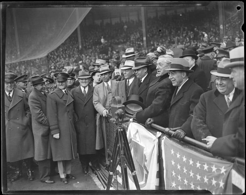 Then-Gov. James Michael Curley, with the hat off, throws out the first pitch at Braves Field in 1935. (Courtesy of the Boston Public Library, Leslie Jones Collection)