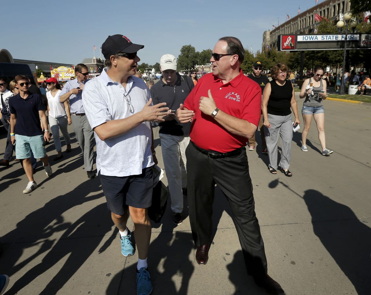 Republican presidential candidate Mike Huckabee talks with a fairgoer at the Iowa State Fair Thursday. (Charlie Riedel/AP)
