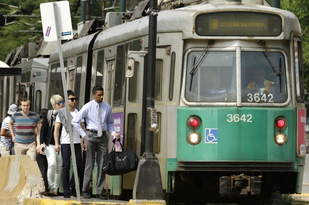 Passengers board an MBTA Green Line in Boston. (Steven Senne/AP)