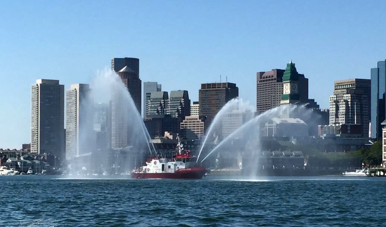 The fire engine boats were out to celebrate the docking of the USS James, a new Coast Guard cutter. (Anthony Brooks/WBUR)