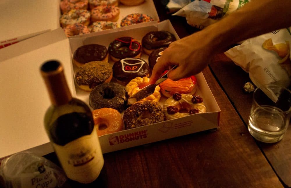 Red wine and donuts at a Groupmuse party in Somerville. (Hadley Green for WBUR)
