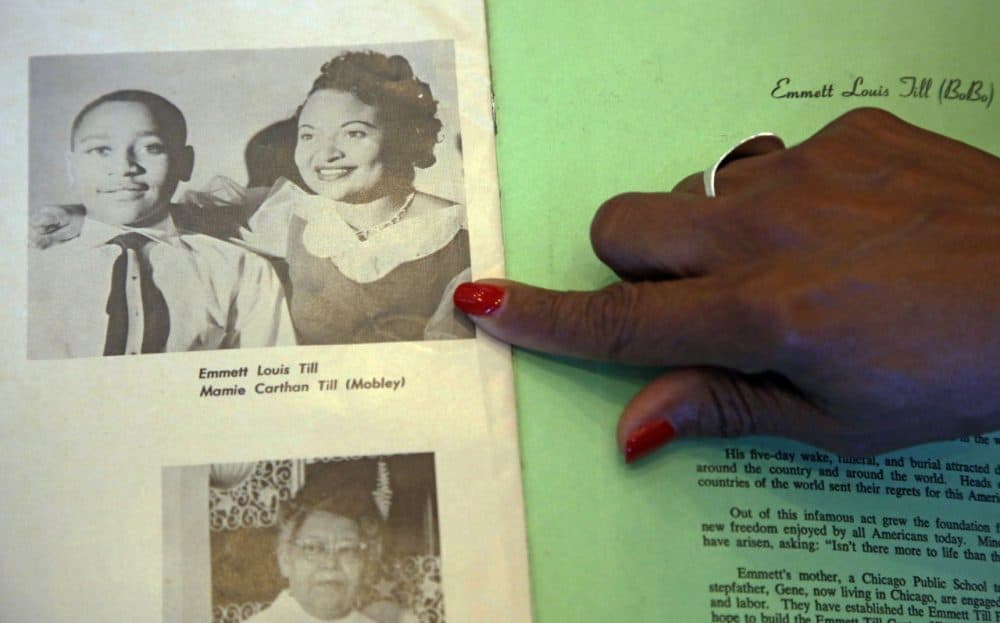 Deborah Watts of Minneapolis points out a widely seen 1950s photograph of her cousin Emmett Till and his mother Mamie Till Mobley, during a visit to Jackson, Miss., Thursday, Aug. 27, 2015 in conjunction with events in Mississippi and Illinois commemorating the 60th anniversary of the slaying of Till, a black 14-year-old from Chicago who was visiting relatives in the Mississippi Delta when witnesses said he violated the Jim Crow social code by whistling at a white woman. He was kidnapped and killed Aug. 28, 1955, and his body was recovered from the Tallahatchie River three days later. An all-white jury acquitted two white men charged in the slaying. (Rogelio V. Solis/AP)