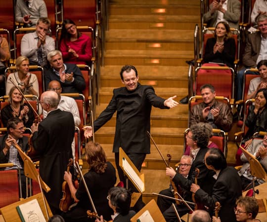 Andris Nelsons bows with the Boston Symphony Orchestra during a performance in Cologne, Germany, on Sept. 4. (Courtesy Marco Borggreve/Boston Symphony Orchestra)