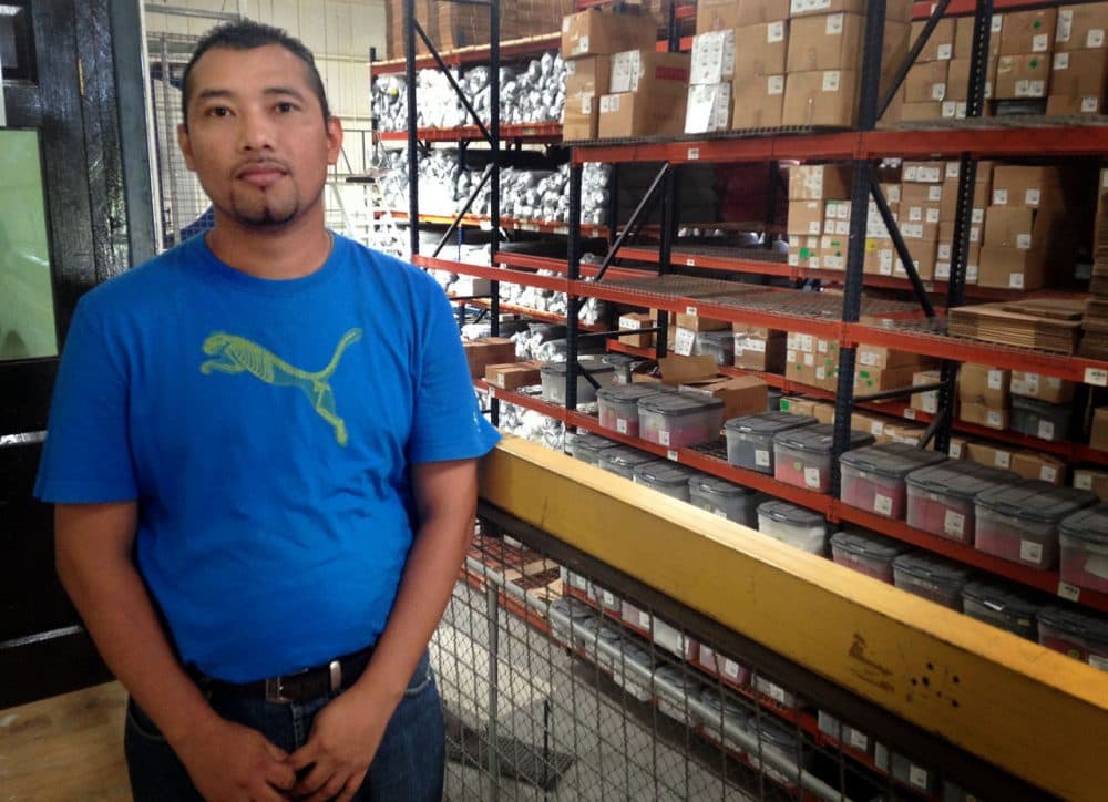 Jaime Martinez Eriqueros was in the gang MS-13 from the age of 15 until he was 28. He now works at the League Collegiate Wear factory in Ciudad Arce, El Salvador. (Fred Thys/WBUR)
